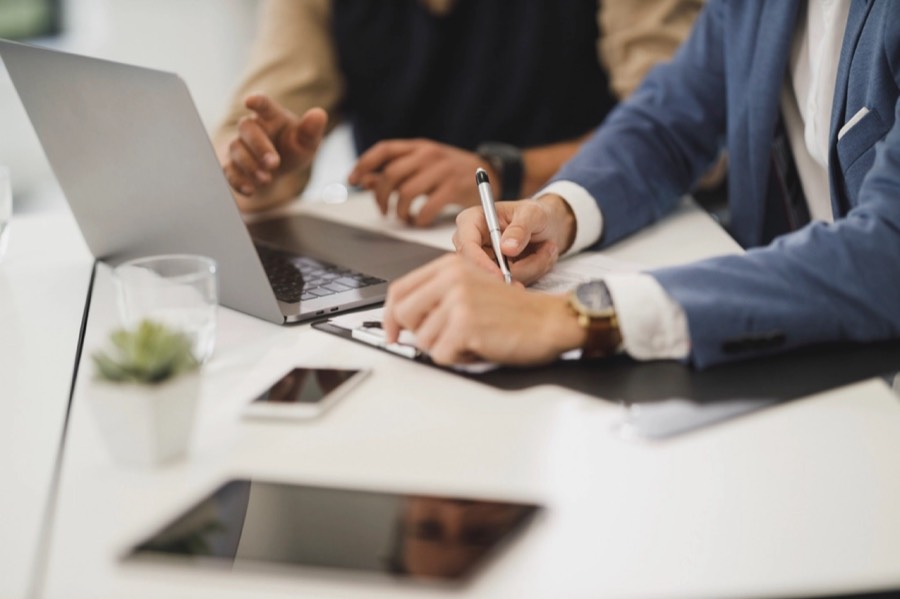 Two people collaborating at a laptop